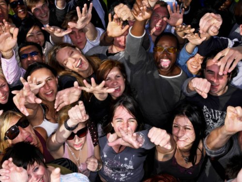 crowd of people at concert holding out hands, portrait, overhead view - concert stock pictures, royalty-free photos & images