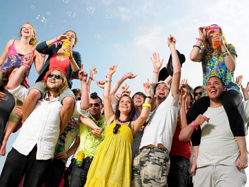 crowd of young people cheering and waving - concert stock pictures, royalty-free photos & images