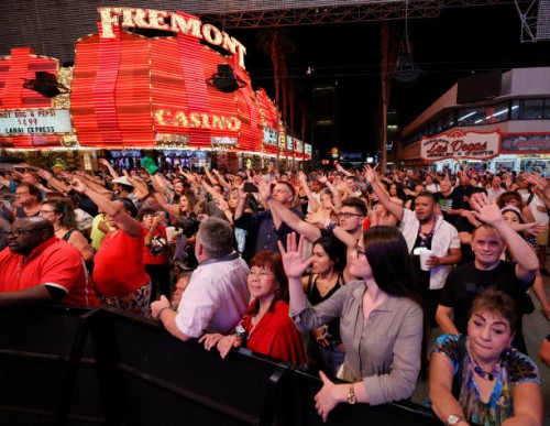 Crowd reacts as they watch musical act Zowie Bowie in concert during a "Downtown Rocks Again!" event at the Fremont Street Experience on June 1, 2021...