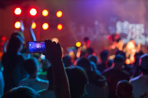 crowd using smart phone at rock concert - concert stock pictures, royalty-free photos & images