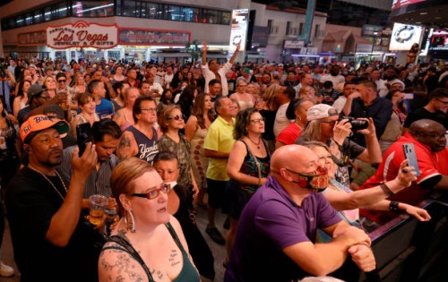Crowd watches musical act Zowie Bowie in concert during a "Downtown Rocks Again!" event at the Fremont Street Experience on June 1, 2021 in Las...