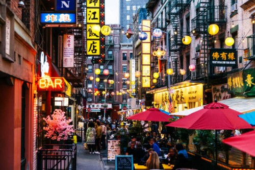 crowded illuminated street with restaurants in bars in chinatown, new york city, usa - food stock pictures, royalty-free photos & images