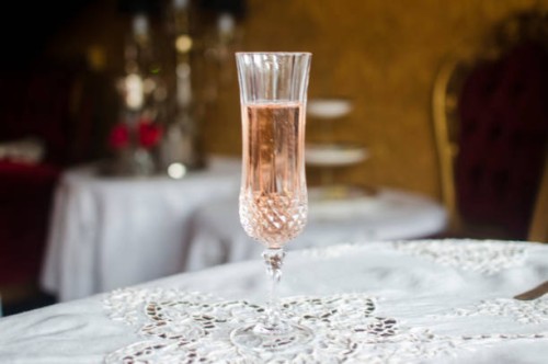 crystal champagne flute, on an white lace tablecloth, in an elegant restaurant - home decoration stock pictures, royalty-free photos & images