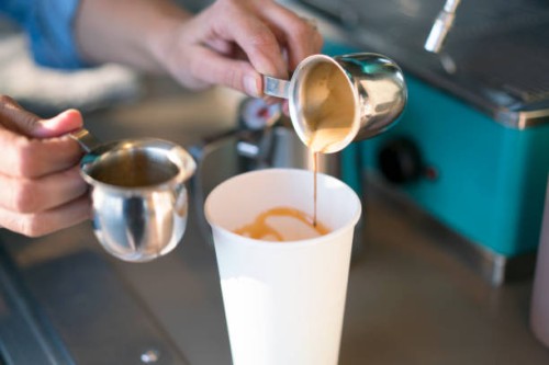cu woman making a coffee drink - junk food stock pictures, royalty-free photos & images
