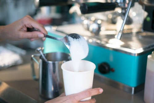 cu woman making a latte - junk food stock pictures, royalty-free photos & images