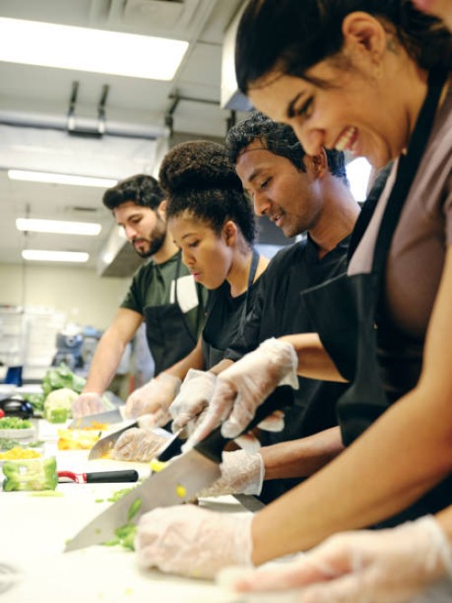 culinary students in a commercial kitchen - food stock pictures, royalty-free photos & images