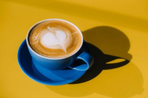 cuo of cappuccino on yellow table - coffee stock pictures, royalty-free photos & images