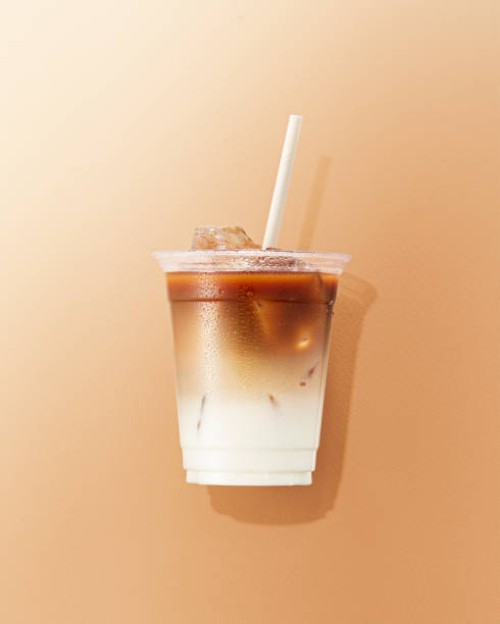 cup of cafe latte on brown background - junk food stock pictures, royalty-free photos & images
