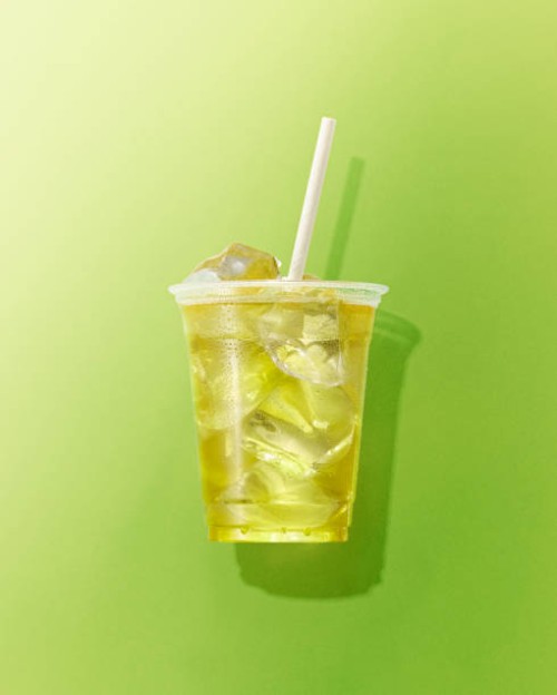 cup of green tea on green background - junk food stock pictures, royalty-free photos & images