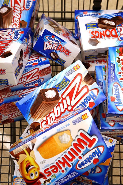 Customer heads to the checkout with a shopping cart loaded with Hostess snacks at a Jewel-Osco grocery store on December 11, 2012 in Chicago,...