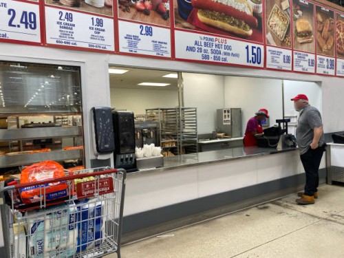 Customer ordering food at Costco, Florida.