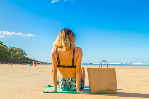 customer receiving a food order in a paradise beach in the middle of nowhere in gold coast area. - junk food stock pictures, royalty-free photos & images
