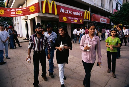 Customers leaving India's first McDonald's, which opened in 1996, in the Visant Vihar, upper/middle class area. For religious reasons, no beef...