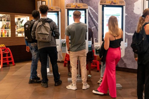 Customers place orders at self-service screens in a McDonald's Corp. Fast food outlet in Strasbourg, France, on Wednesday, Sept. 14, 2022. French...