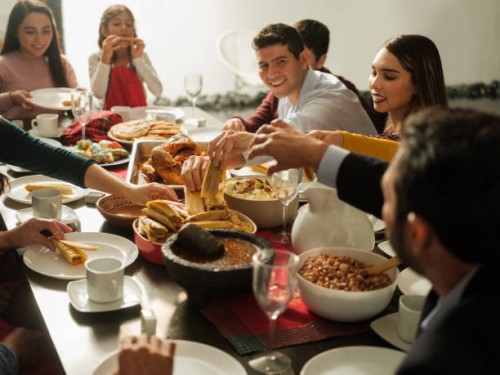 cute family eating mexican food together for christmas - garden decoration stock pictures, royalty-free photos & images
