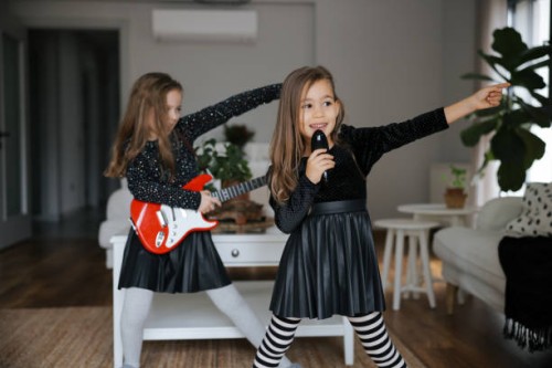 cute girls playing guitar and singing - concert stock pictures, royalty-free photos & images