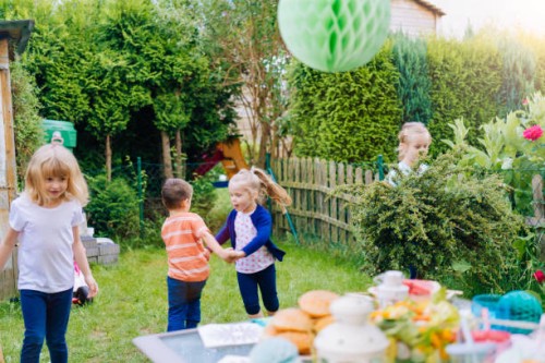 cute kids having fun outside for summer backyard party - garden decoration stock pictures, royalty-free photos & images
