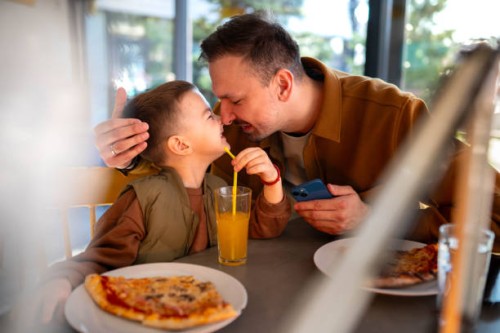 dad and soon eating pizza - junk food stock pictures, royalty-free photos & images