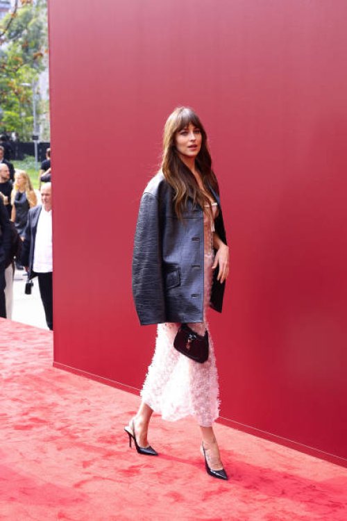 Dakota Johnson attends the Gucci Women's Spring Summer 2025 Fashion Show during the Milan Fashion Week Womenswear Spring/Summer 2025 at Triennale di...