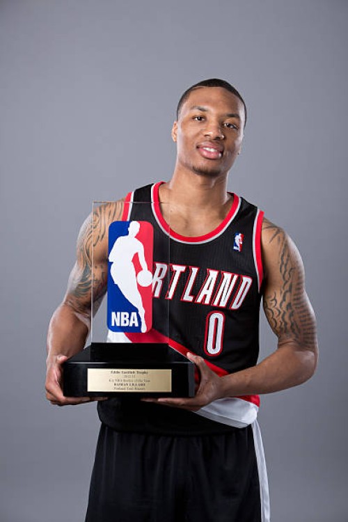 Damian Lillard of the Portland Trail Blazers poses with the Eddie Gottlieb Trophy after winning the 2012-2013 Kia NBA Rookie of the Year award on May...