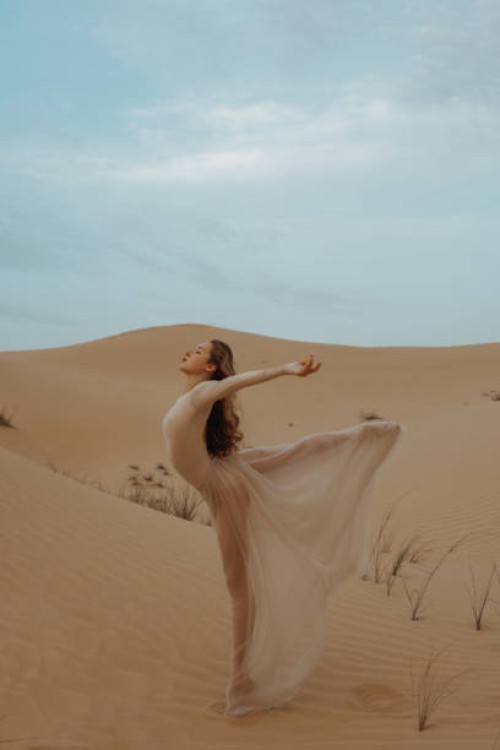 dance of elegance: graceful movement in the desert - fashion stock pictures, royalty-free photos & images
