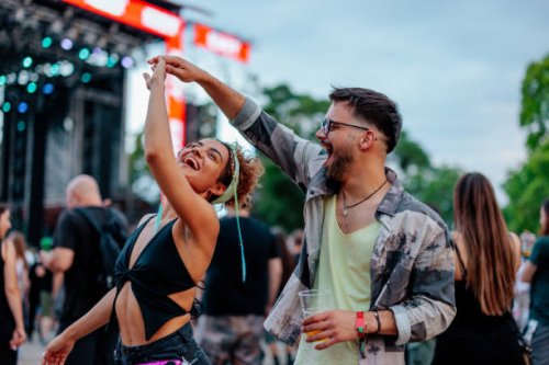 dancing couple at concert - concert stock pictures, royalty-free photos & images