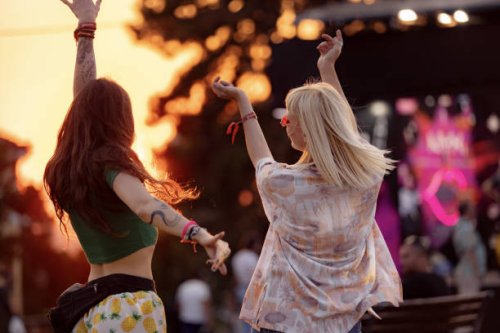 dancing on a music festival at sunset! - concert stock pictures, royalty-free photos & images