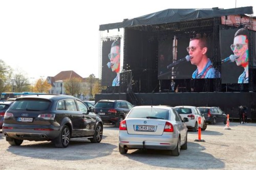 Danish singer and songwriter Mads Langer preforms at a sold-out drive-in concert at Tangkrogen in Aarhus, Denmark on April 24, 2020. / Denmark OUT