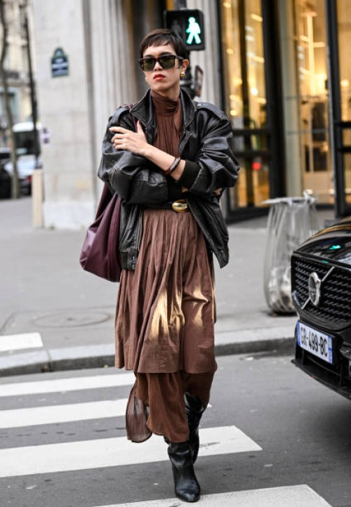 Dara is seen wearing a sheer brown top, brown skirt, brown pants, black boots outside the Vetements show during the Womenswear Fall/Winter 2024/2025...