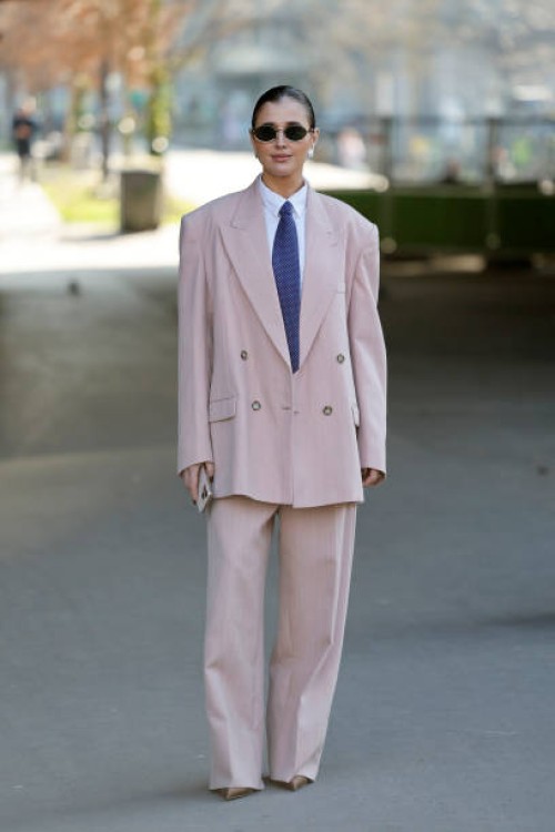 Darja Barannik wears white shirt, blue tie, pink suit, outside Stella McCartney, during the Womenswear Fall/Winter 2025/2026 as part of Paris Fashion...
