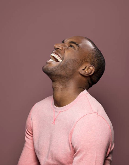 dark skinned looking up, laughing - hairstyle stock pictures, royalty-free photos & images