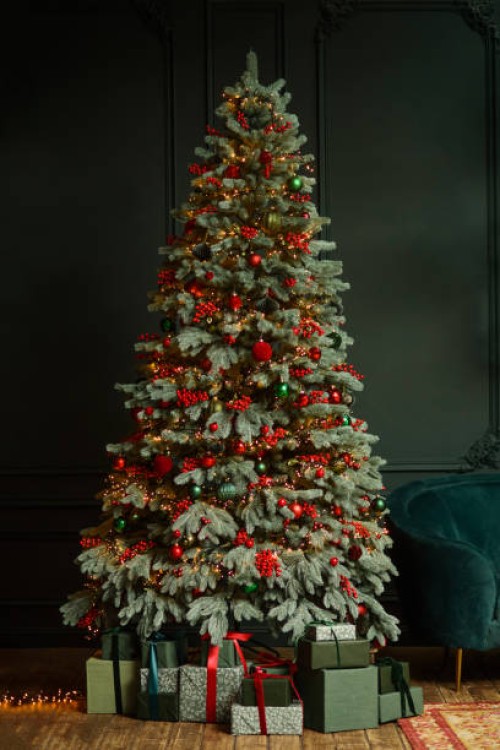 decorated christmas tree on green night background. happy holidays. - home decoration stock pictures, royalty-free photos & images