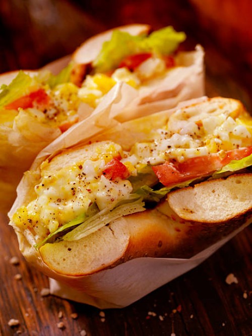 deli style egg salad bagel sandwich - junk food stock pictures, royalty-free photos & images
