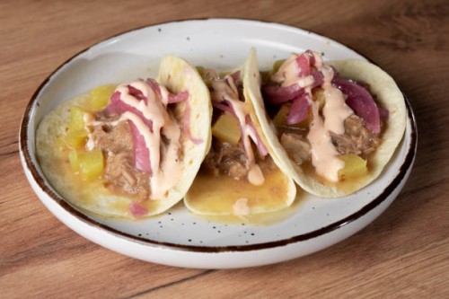 delicious tacos al pastor with pineapple and red onion on a plate - junk food stock pictures, royalty-free photos & images