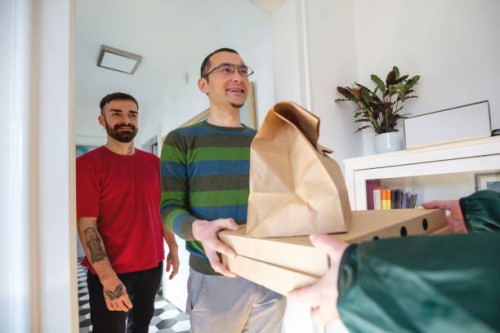 delivering take aways - junk food stock pictures, royalty-free photos & images