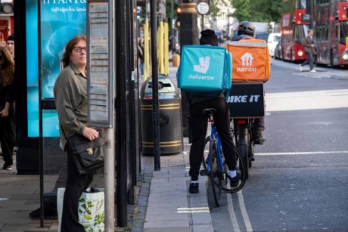 Deliveroo and Just Eat takeaway delivery cycle couriers on Oxford Street on 6th October 2024 in London, United Kingdom. Just Eat Limited is a British...
