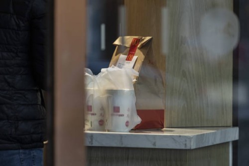 Delivery bag on the counter of a McDonald's Corp. Restaurant in Shanghai, China, on Wednesday, Nov. 22, 2023. Carlyle Group Inc. Agreed to sell its...