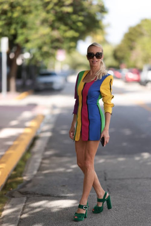 Denisa Palsha seen wearing a Vintage colourful striped mini dress, green velvet Prada heels and glasses by Tom Ford on December 03, 2022 in Miami,...
