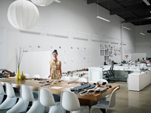 designer standing at conference table - fashion stock pictures, royalty-free photos & images
