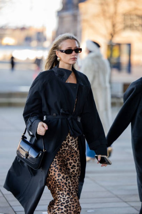 Desiré Inglander wears black bag, leopard skirt, black coat outside OpéraSport during the Copenhagen Fashion Week AW24 on January 31, 2024 in...