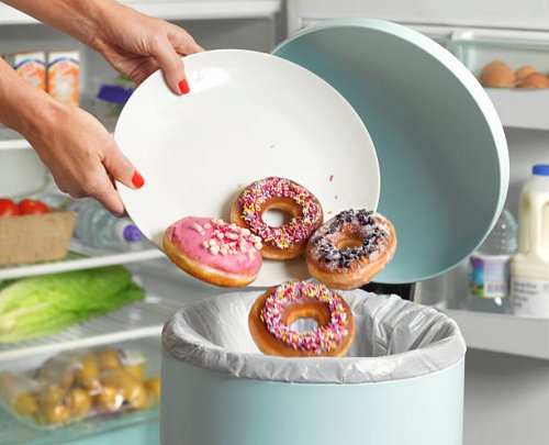 dieter throwing away donuts - junk food stock pictures, royalty-free photos & images