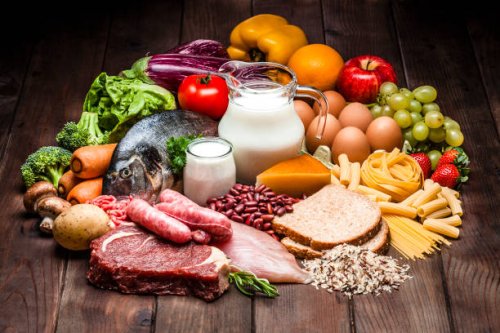 different types of food on rustic wooden table - food stock pictures, royalty-free photos & images