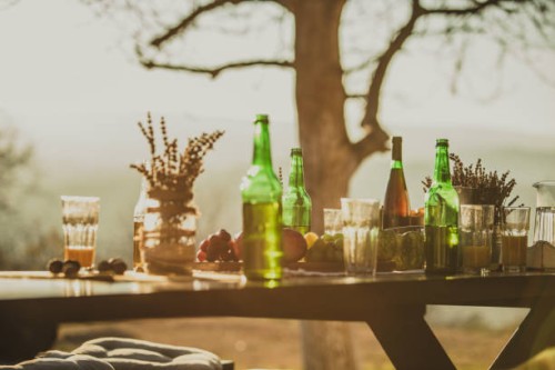 dining table with drinks for party at backyard during autumn - garden decoration stock pictures, royalty-free photos & images