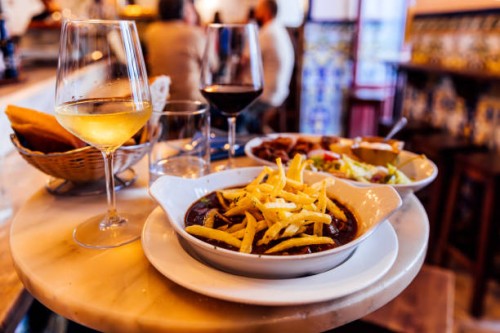 dinner with meat dish and wine at spanish restaurant in madrid, spain - food stock pictures, royalty-free photos & images