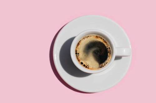 directly above shot of coffee on pink color background. - coffee stock pictures, royalty-free photos & images