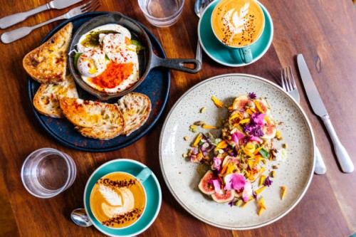 directly above view of breakfast with fig toast and poached eggs in a skillet - food stock pictures, royalty-free photos & images