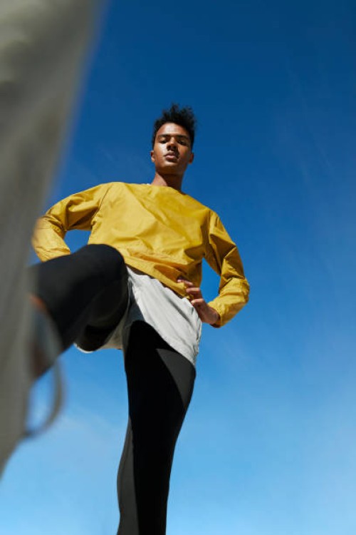 directly below portrait of sportsman against clear sky - fashion stock pictures, royalty-free photos & images