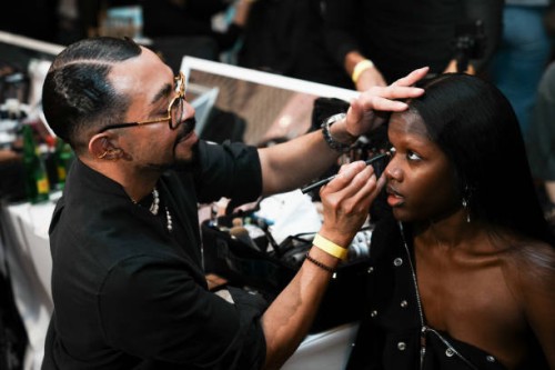 Director of Makeup for MAC Cosmetics, Romero Jennings, prepares a model backstage at the Kim Shui fashion show during 2025 New York Fashion Week on...