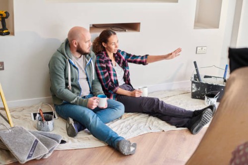 diy couple taking a break - home decoration stock pictures, royalty-free photos & images