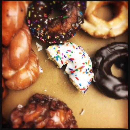 donuts eaten - junk food stock-fotos und bilder
